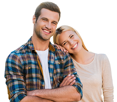 Man in plaid smiling with his arms crossed and woman smiling with her head on his shoulder